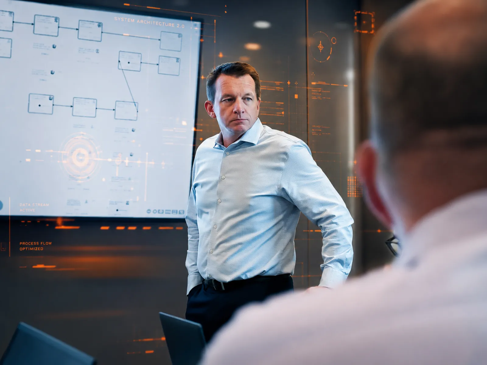 An Aligned Technology Partners leader reviewing a cloud system architecture diagram on screen